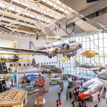 A large gallery of planes and other flying machines within a museum