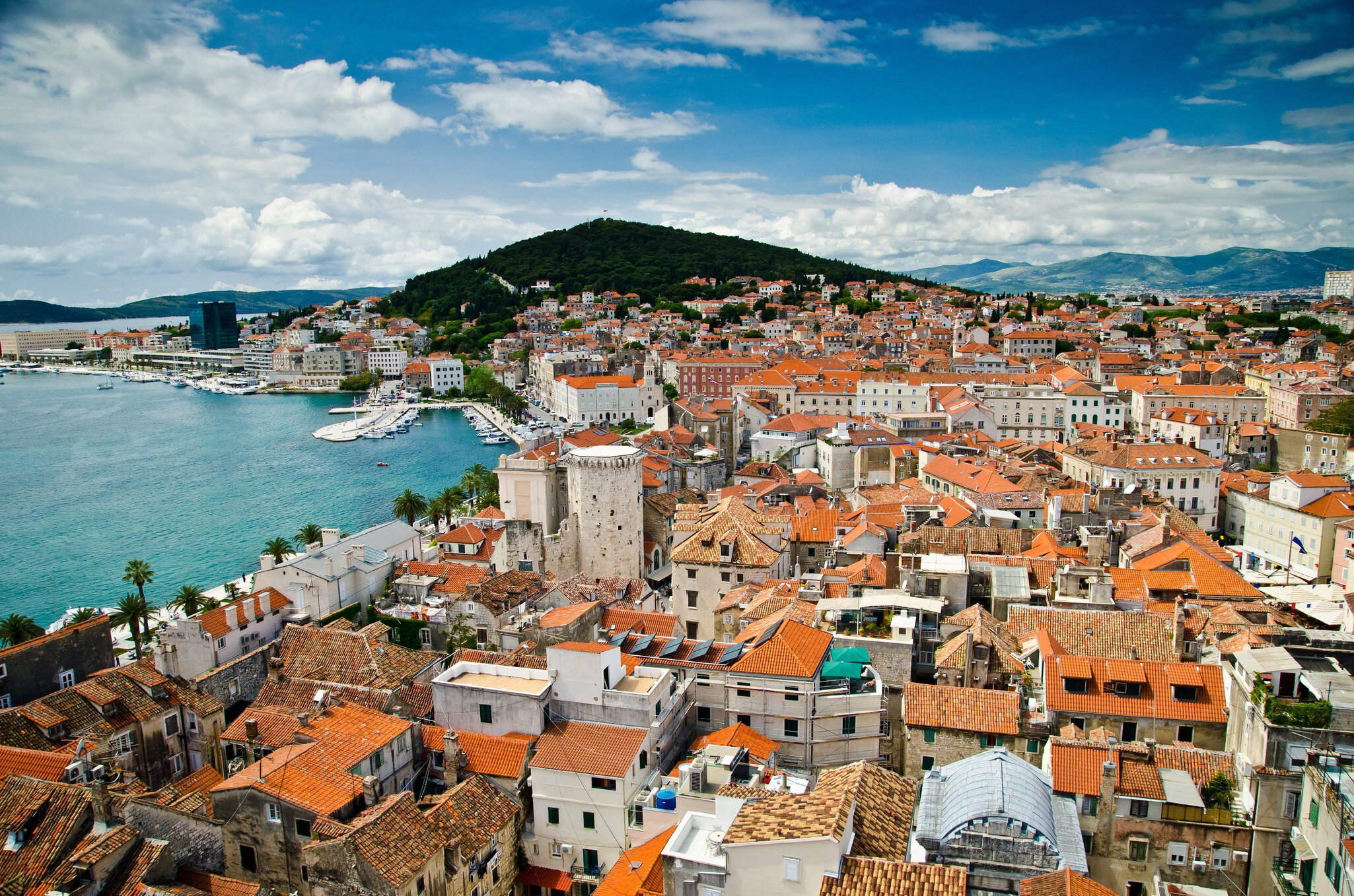 Aerial of Split's historic Diocletian's Palace, Old Town and Marjan hill.