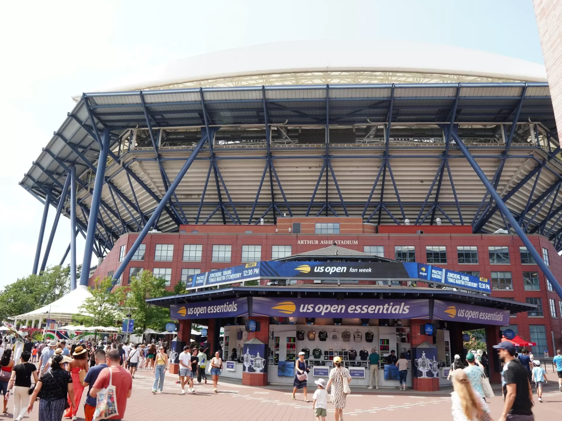 Spectators mill around the outside of Arthur Ashe Stadium at Billy Jean King Tennis Center in Queens, NY.