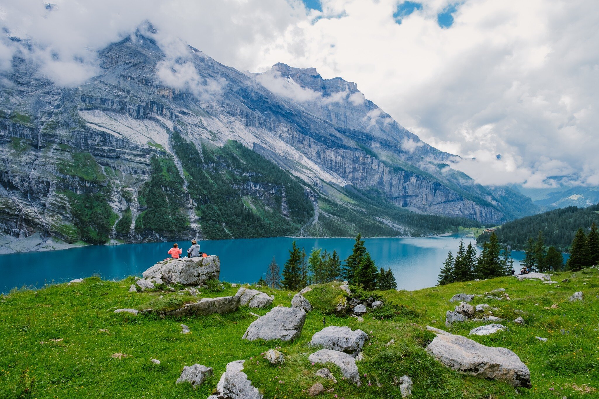 An attractive summer morning on the unique Oeschinensee Lake. A wonderful outdoor scene in the Swiss Alps with Bluemlisalp mountain, Kandersteg village location, Switzerland, Europe. ; Shutterstock ID 2105333216;