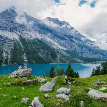 An attractive summer morning on the unique Oeschinensee Lake. A wonderful outdoor scene in the Swiss Alps with Bluemlisalp mountain, Kandersteg village location, Switzerland, Europe. ; Shutterstock ID 2105333216;