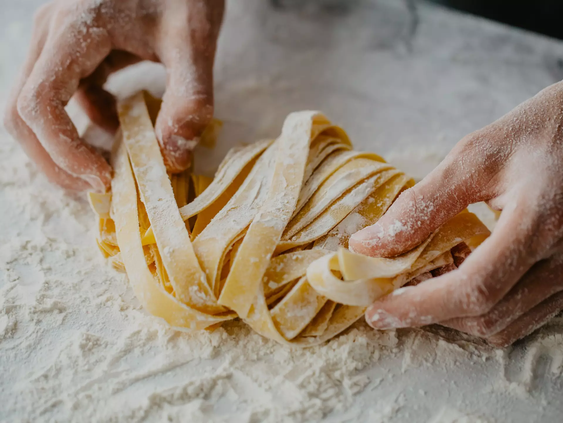 Closeup of process of making cooking homemade pasta. Chef make fresh italian traditional pasta , License Type: media, Download Time: 2025-12-09T22:12:31.000Z, User: Norma.PrauseBrewer_LonelyPlanet, Editorial: false, purchase_order: 56530 - Guidebooks, job: Global Publishing WIP, client: Europe 5, other: Norma Brewer