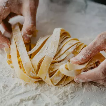 Closeup of process of making cooking homemade pasta. Chef make fresh italian traditional pasta , License Type: media, Download Time: 2025-12-09T22:12:31.000Z, User: Norma.PrauseBrewer_LonelyPlanet, Editorial: false, purchase_order: 56530 - Guidebooks, job: Global Publishing WIP, client: Europe 5, other: Norma Brewer