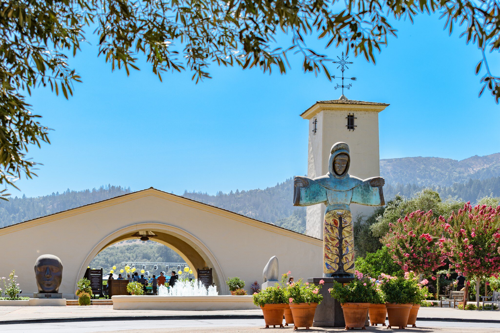 NAPA VALLEY, CALIFORNIA - AUGUST 17, 2019: Robert Mondavi Winery, Kalon Vineyard entrance, with statue of St. Francis of Assisi by sculptor Beniamino Bufano in the foreground.  License Type: media  Download Time: 2021-01-27T13:39:52.000Z  User:   Is Editorial: Yes  purchase_order:   