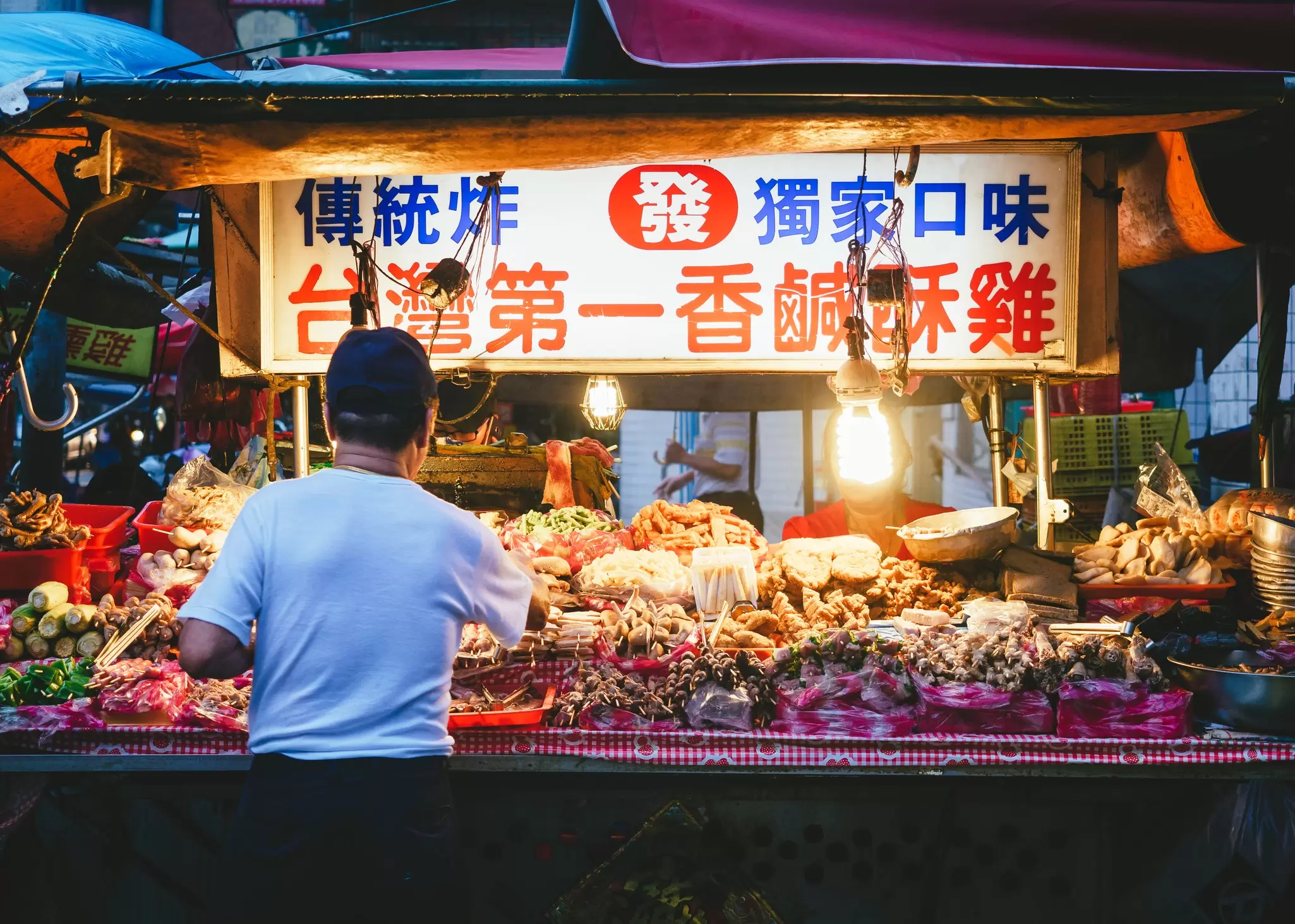 Vendor at a night market in Taipei. VTT Studio/Shutterstock
