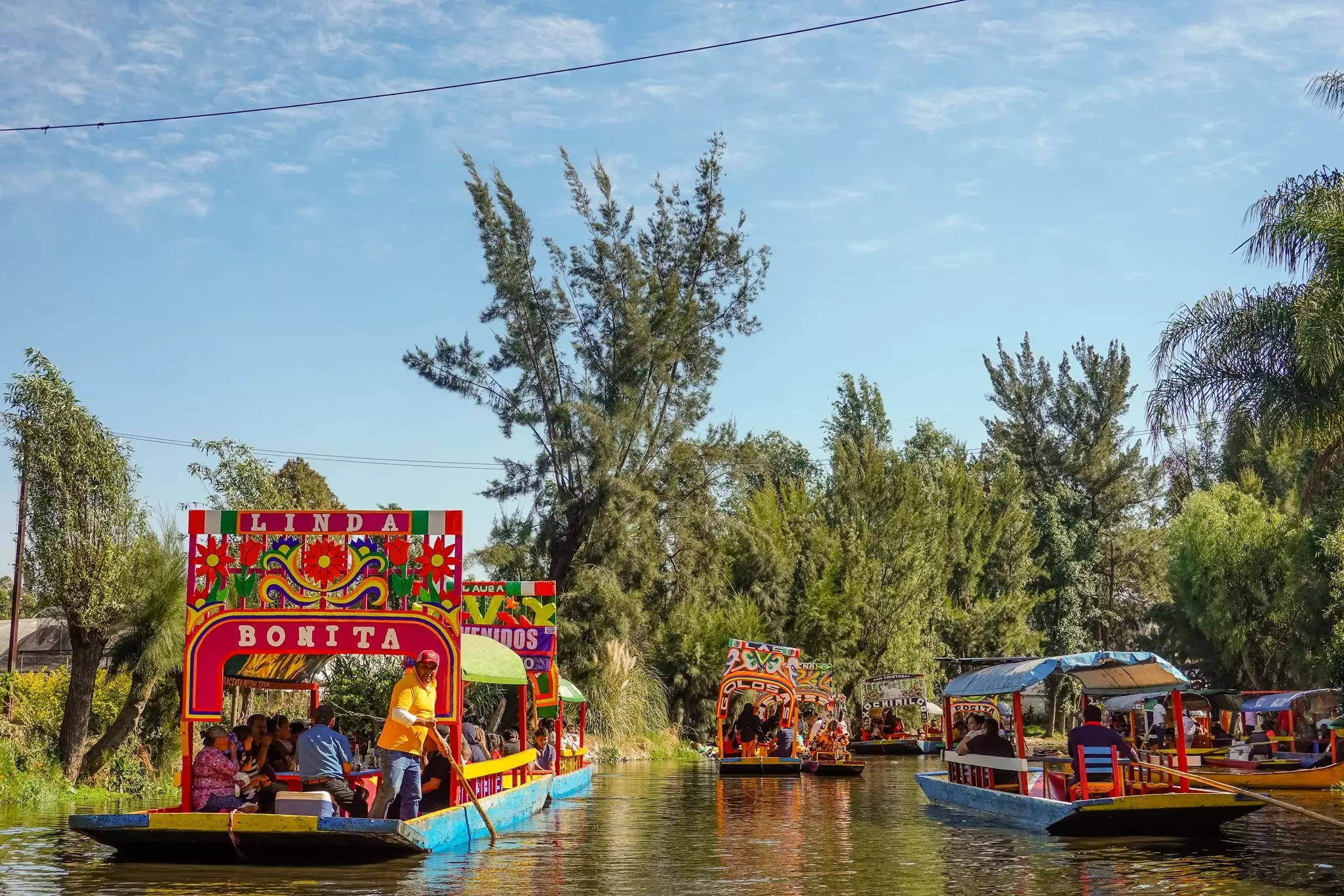 Colorful boats on the canal in Xochimilco. Shutterstock/Shawn Goldberg