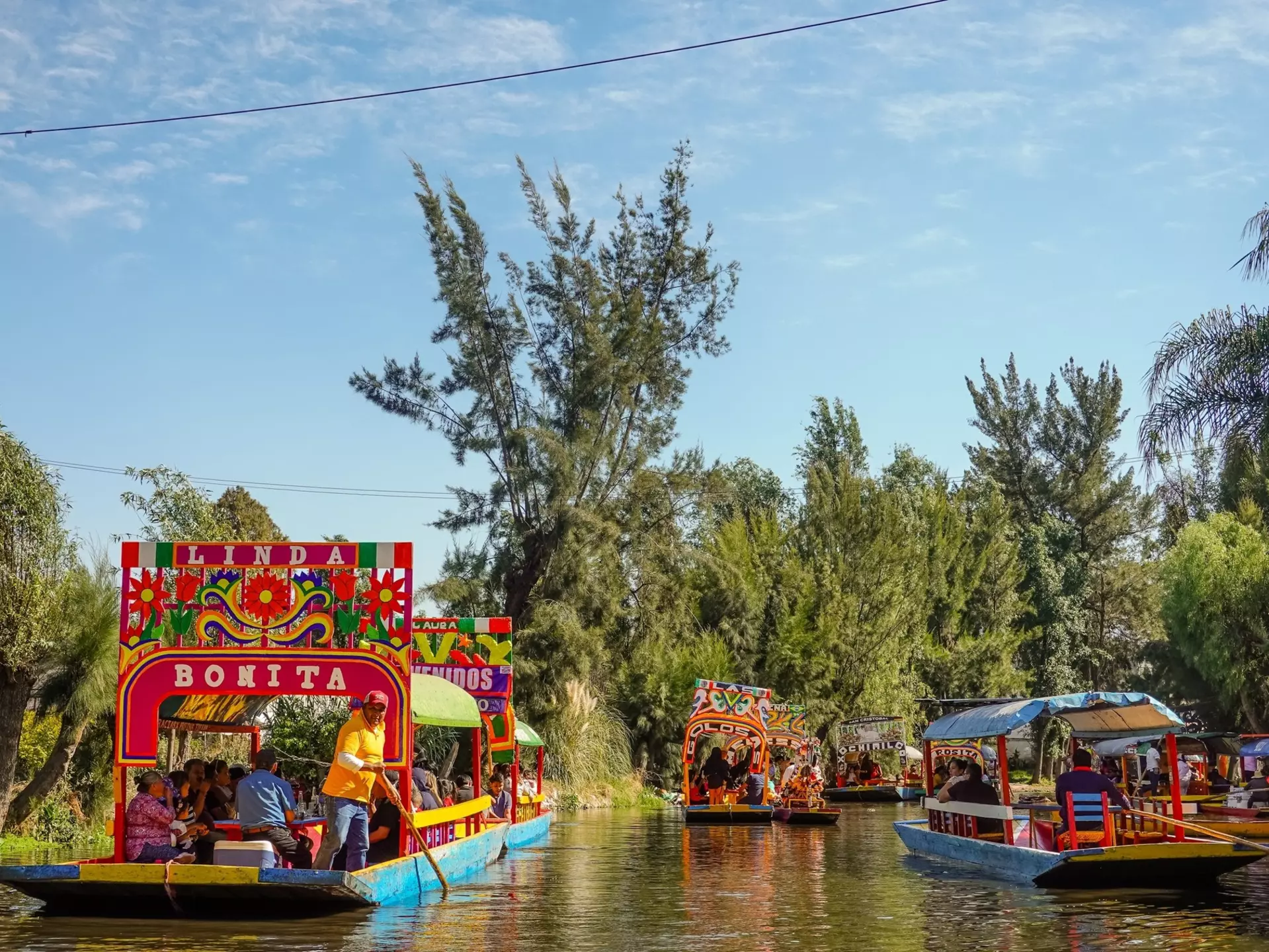 Colorful boats on the canal in Xochimilco. Shutterstock/Shawn Goldberg