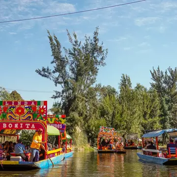 Colorful boats on the canal in Xochimilco. Shutterstock/Shawn Goldberg