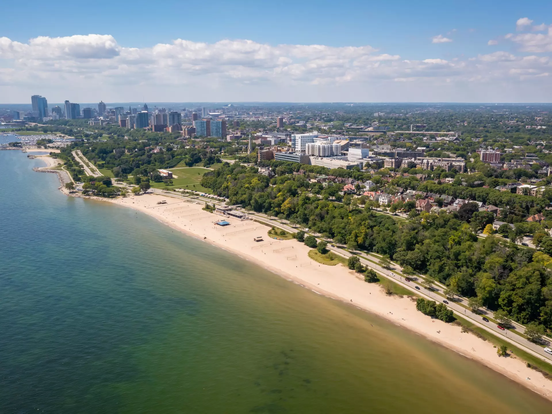 Aerial view Lake Michigan coastline featuring Lake Park, Bradford Beach and downtown Milwaukee skyline.  License Type: media  Download Time: 2021-10-06T09:18:16.000Z  User: clairenaylor  Is Editorial: No  purchase_order:   