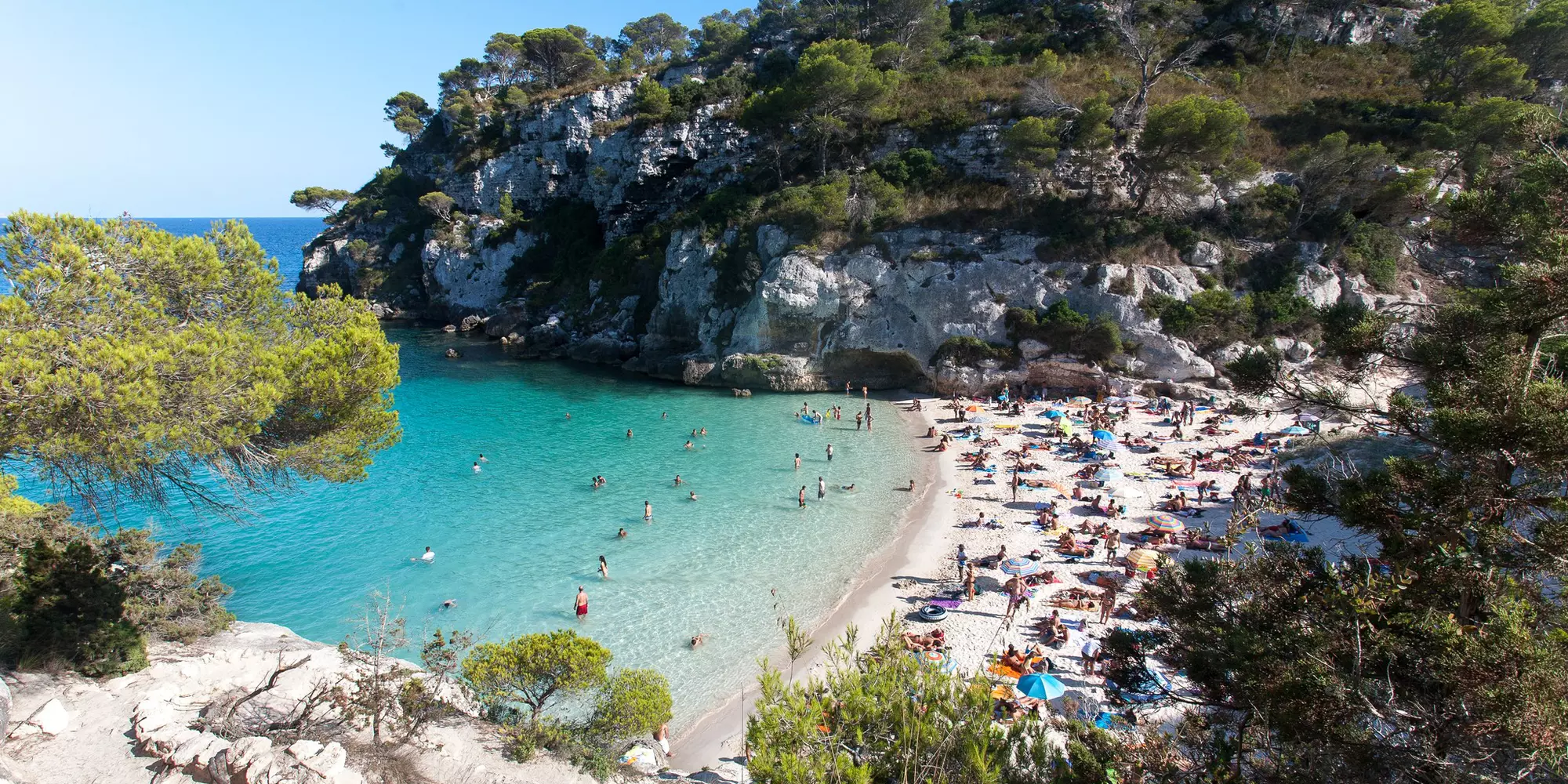 Cala Macarella and Cala Macarelleta in Minorca, Balearic Islands, Spain. Beautiful white sandy beach with crystal clear water in Menorca, Spain.