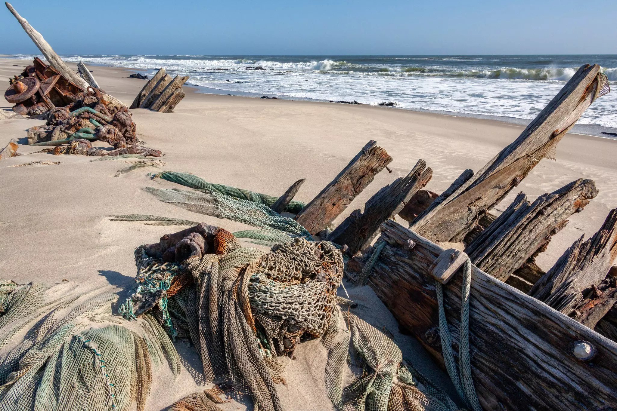 Wreckage of an old wooden fishing boat on the Skeleton Coast in Namibia.