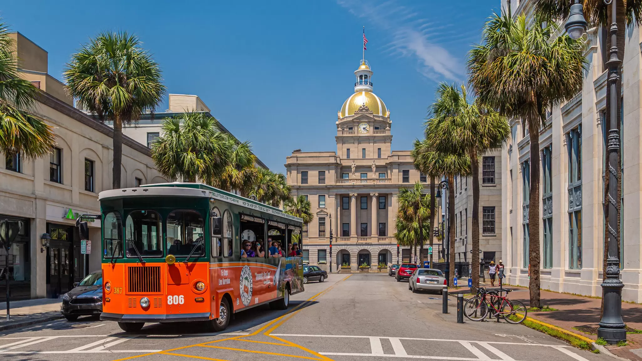 A trolley tour bus rolls through downtown Savannah, Georgia. Darryl Brooks/Shutterstock