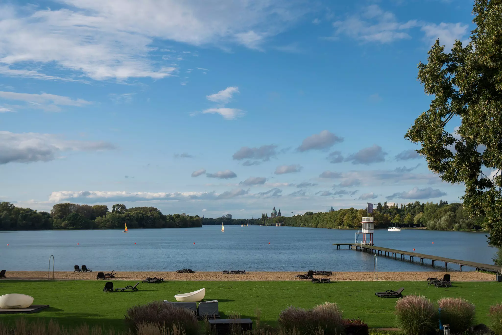 An artificial lake with a neat sandy beach.