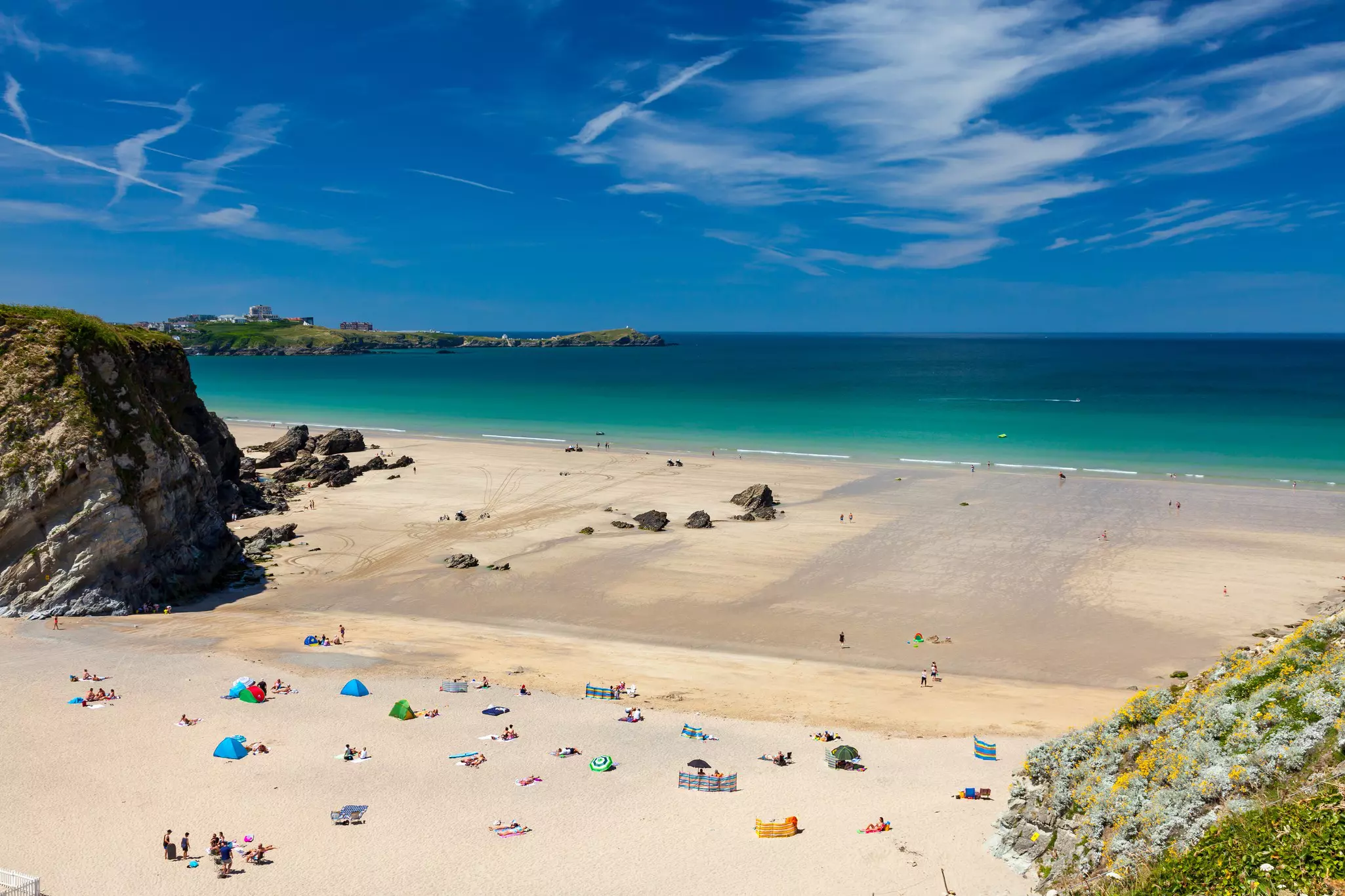 Stunning blue sky above Lusty Glaze Beach, Newquay, Cornwall, England.