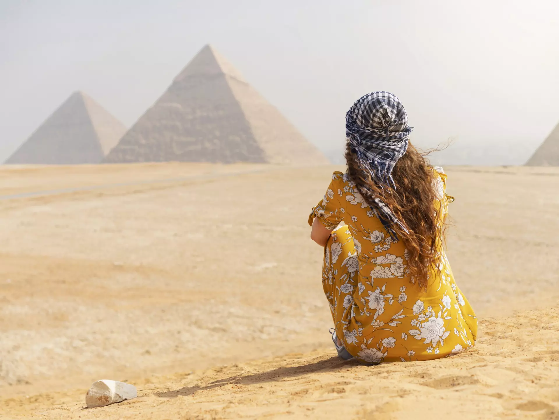 A female tourist sitting on a sand dune and looking at the Pyramids of Giza.
1135422752
Desert, Khafre, Copy Space, Egypt, Photography, Ancient History, Travel Destinations, Horizontal, Only Women, Human Back, Ancient, Pyramid, Young Adult, Archaeology, Pharaoh, Adults Only, Middle East, Tourism, Women, Architecture, Tourist, Giza Pyramids, Awe, History, Females, Capital Cities, One Woman Only, Kheops Pyramid, Adult, Looking At View, Antique, Cairo, Explorer, Old Ruin, Egyptian Culture, Cultures, Giza, Young Women, The Past, Caucasian Ethnicity, Africa, Pyramid of Mycerinus, Travel, Back, Ancient Egyptian Culture, Monument, UNESCO World Heritage Site, Temple - Building, Pyramid Shape, People, Rear View, Famous Place, International Landmark, Majestic, Pyramid of Chephren, Ancient Civilization, Vacations, One Person, One Young Woman Only, Journey