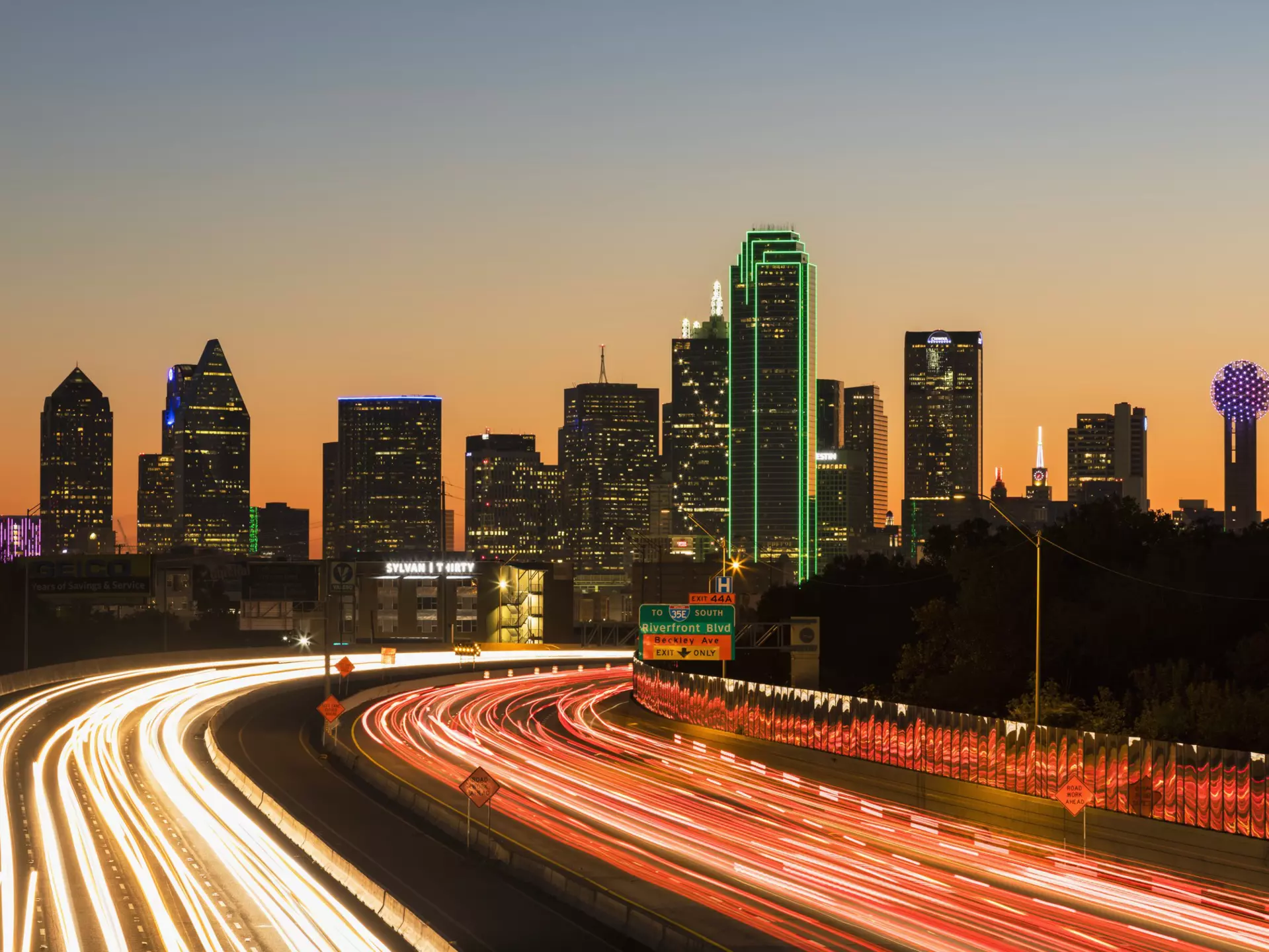 Driving 1-30 at night into Dallas. Westend61/Getty Images