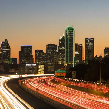 Driving 1-30 at night into Dallas. Westend61/Getty Images