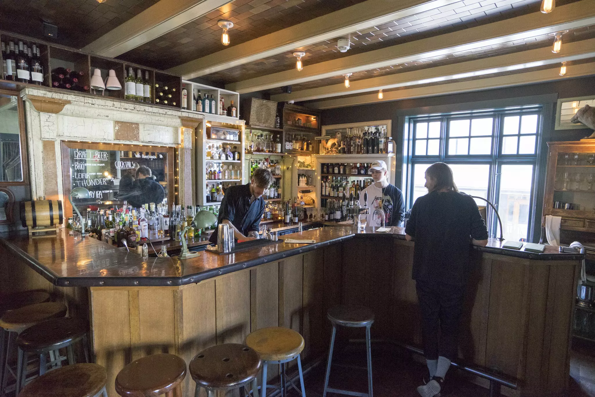 The interior of a cozy local pub in Reykjavík, Iceland.