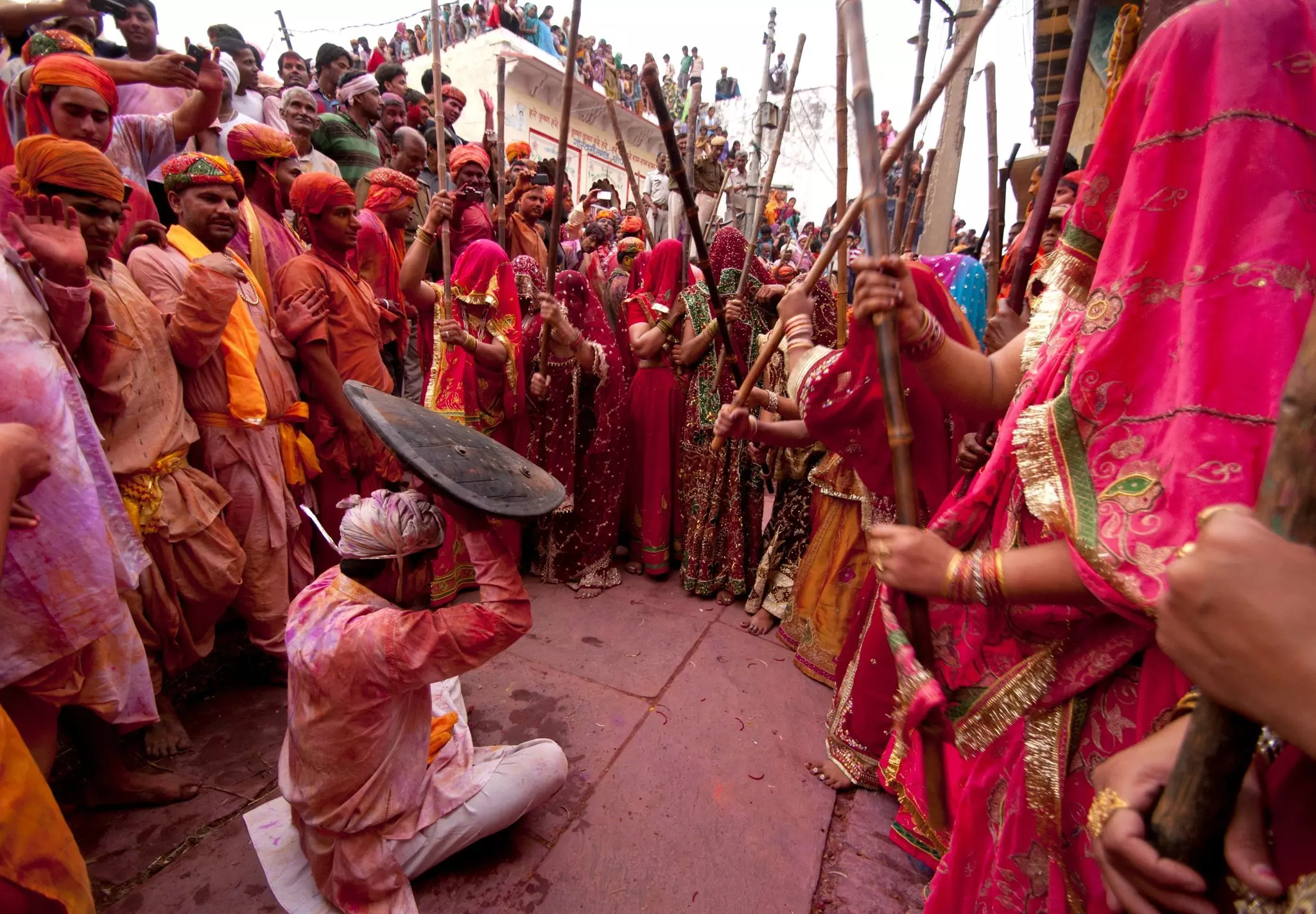 Women beat men with long sticks as part of the Lathmar Holi celebration in Nandgaon, India.