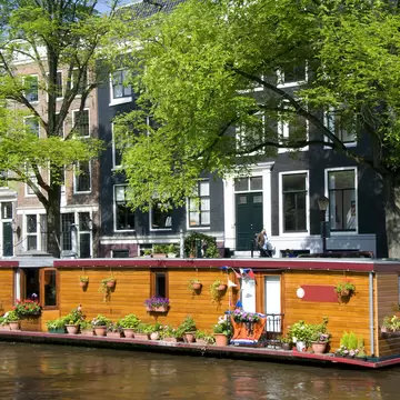 amsterdam holland canal house boat with flowers