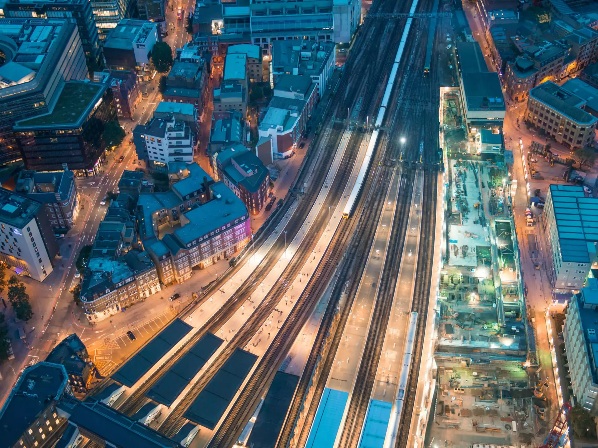 London. Train station and Tower Bridge night lights, aerial view.
213540391
tracks, network, tower, street, aerial, many, river, view, london, urban, landmark, rail, building, train, dark, transport, place, famous, architecture, city, above, railway, outdoors, transportation, thames, tourism, station, bridge, image, europe, exterior, multiple, landscape