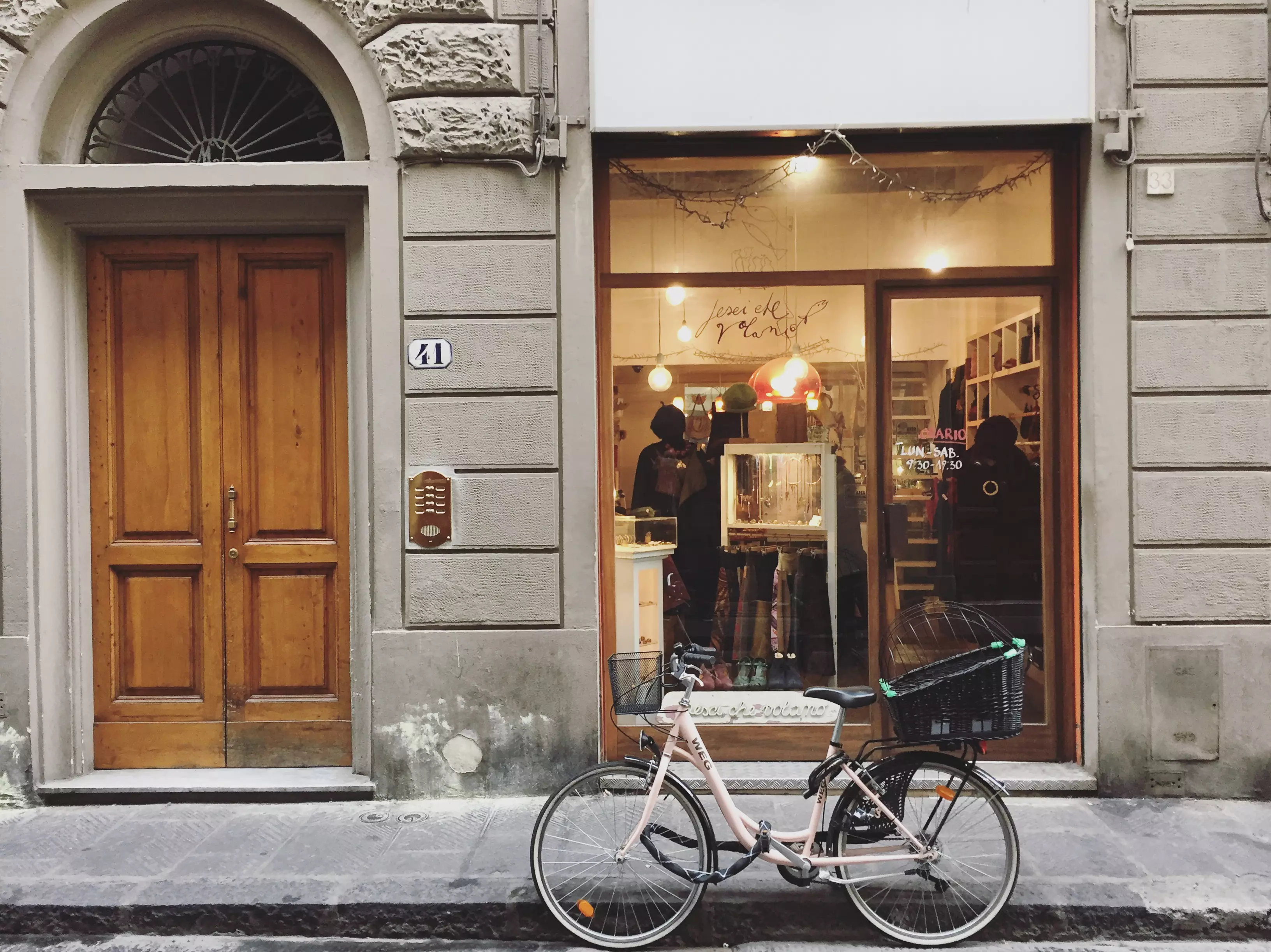Shop front in Florence with a bicycle in the foreground