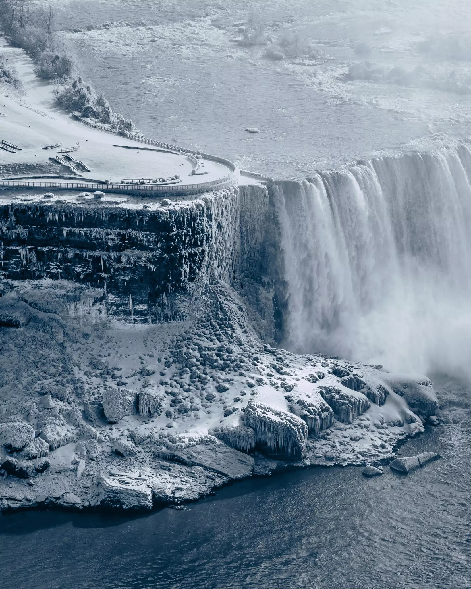 Niagara falls in winter, taken from Skylon Tower. USA observatory side frozen and covered with snow.