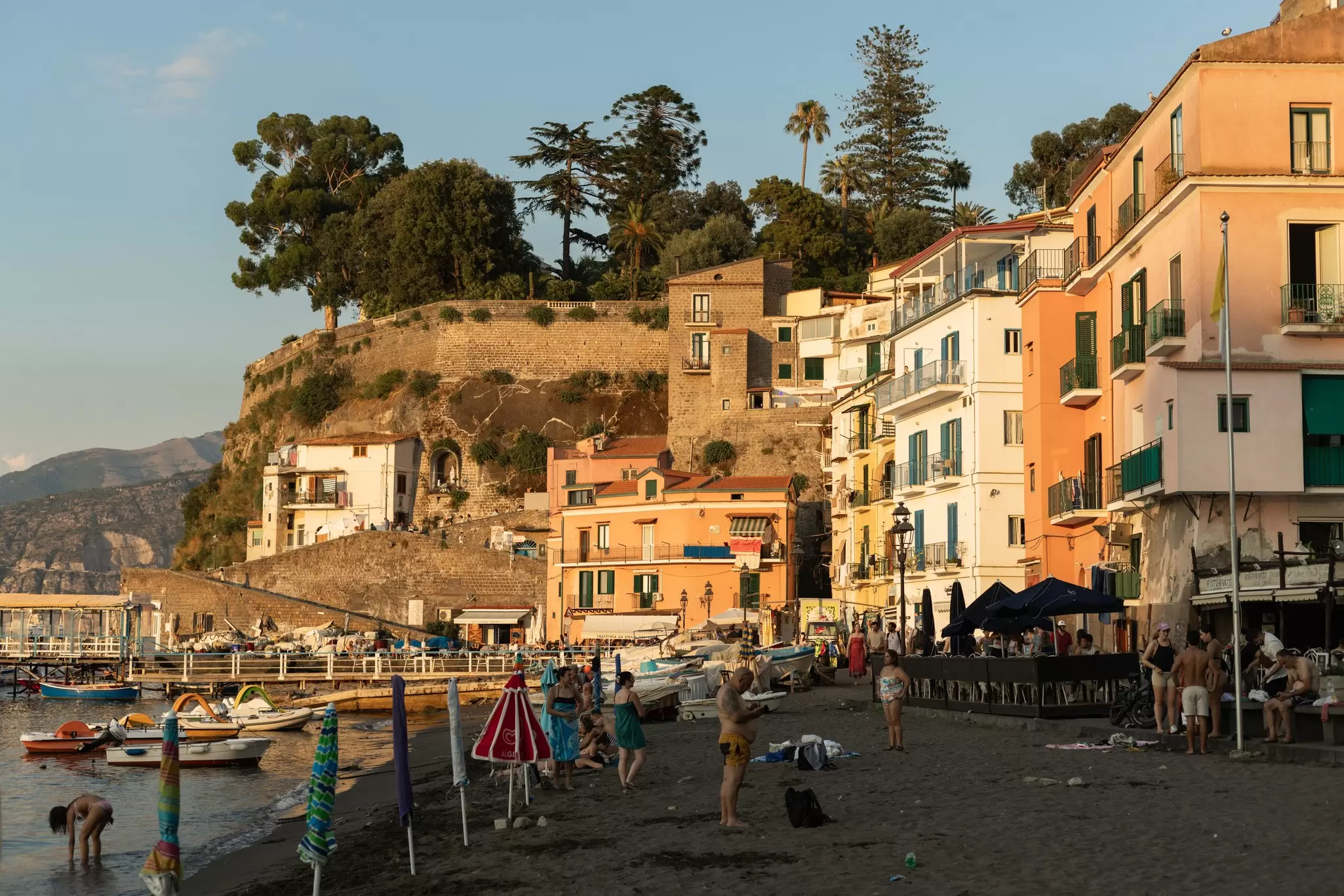 Crowds of people relaxing on a sunny summer's day at the Marina Grande.