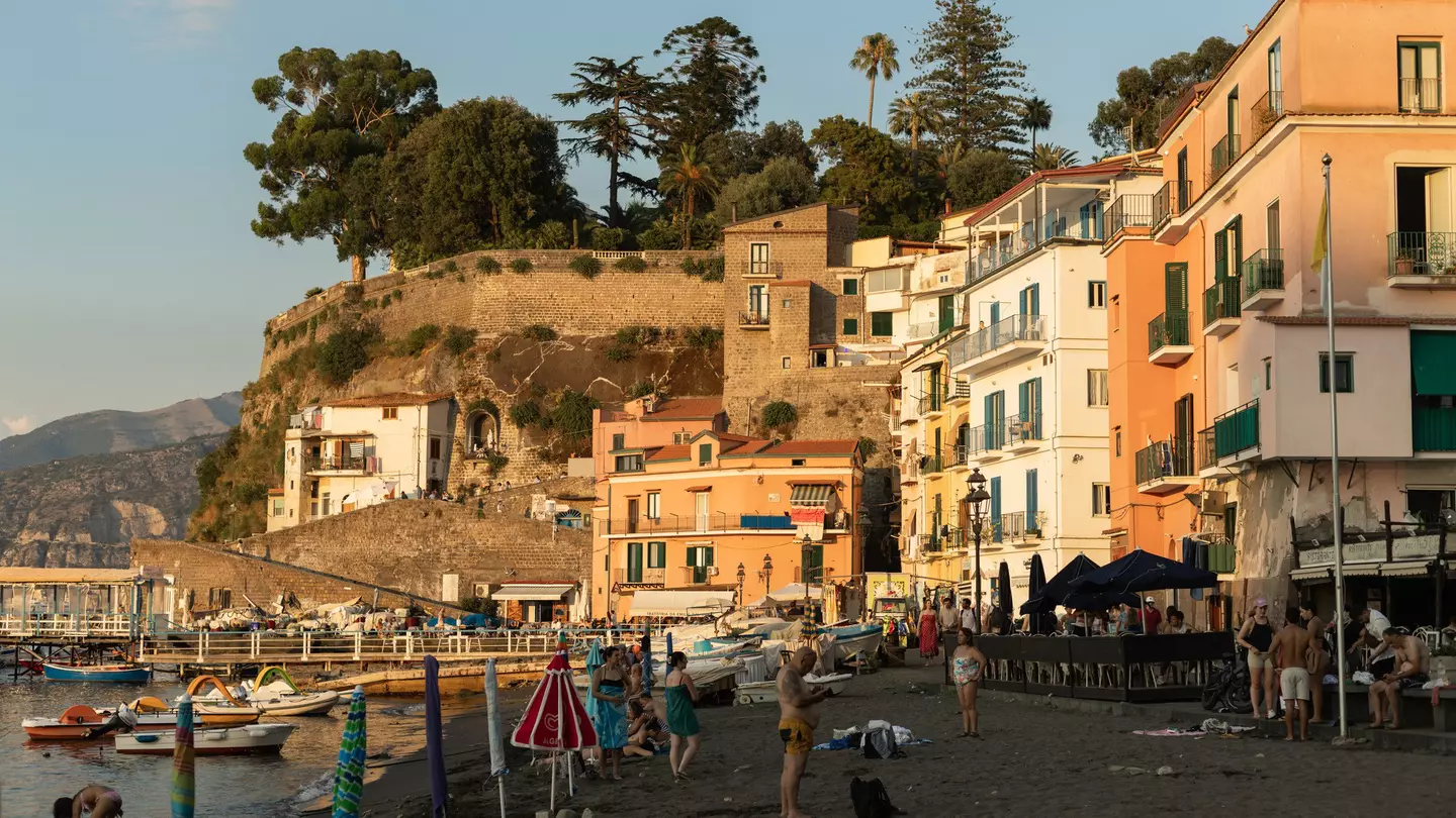 Crowds of people relaxing on a sunny summer's day at the Marina Grande.