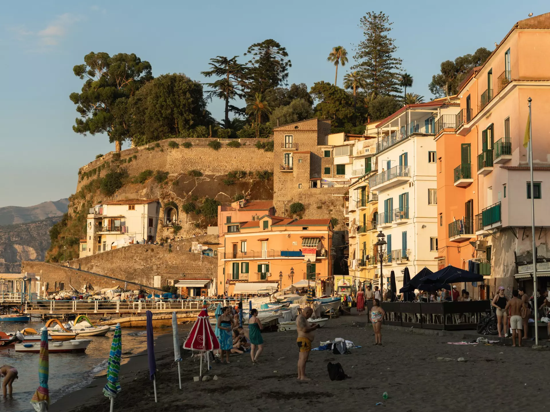 Crowds of people relaxing on a sunny summer's day at the Marina Grande.