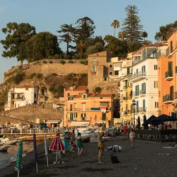 Crowds of people relaxing on a sunny summer's day at the Marina Grande.