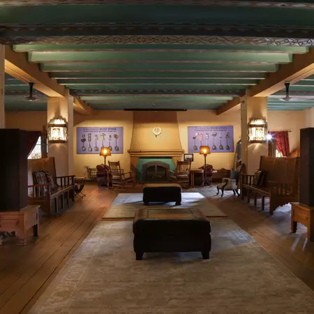 The hotel's Southwestern ballroom, a cozy space with wooden furnishings.