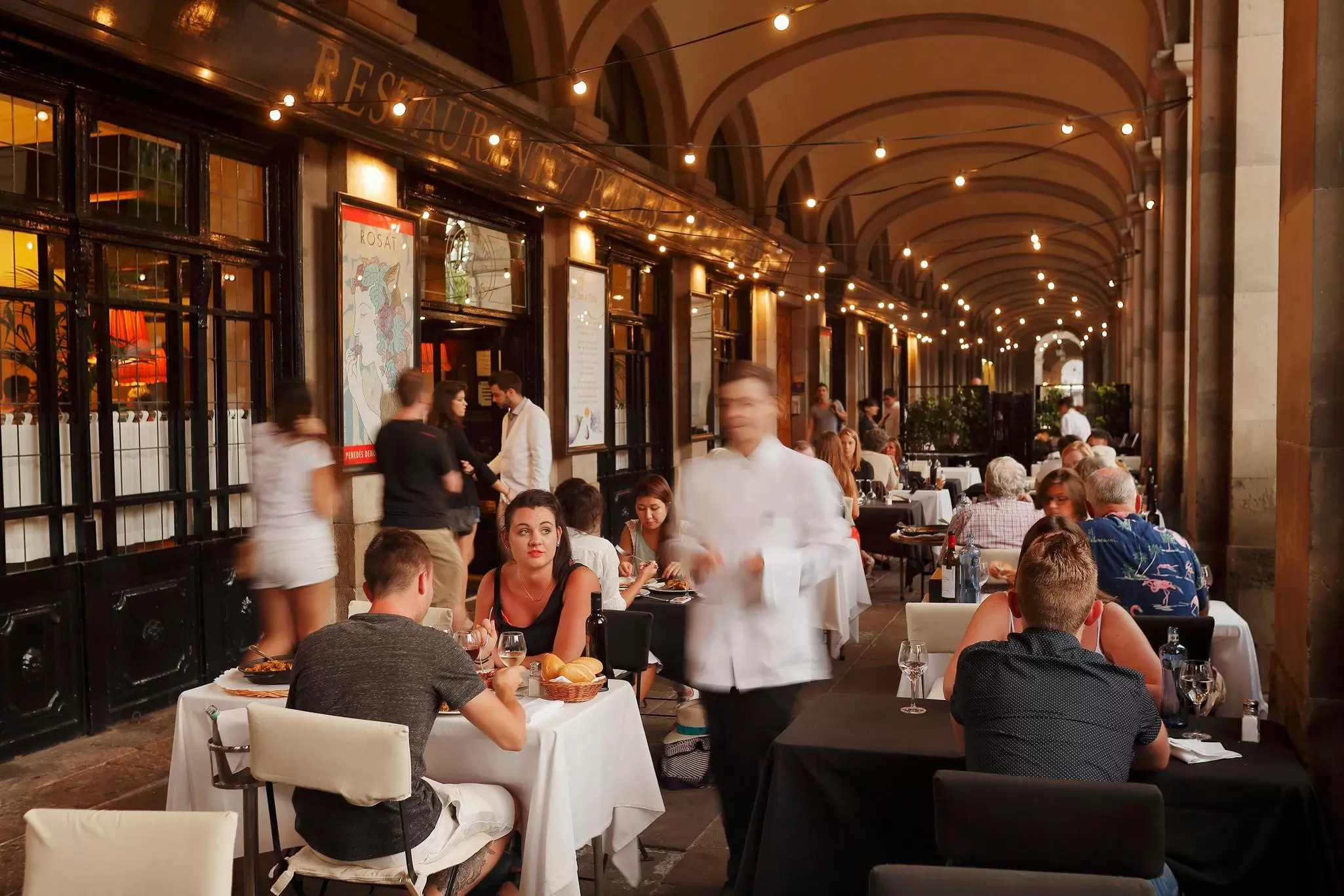 Tables outside the restaurant '7 Portes', Barcelona, Spain