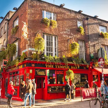 February 18, 2018: Exterior of the Temple Bar pub in the Temple Bar area of Dublin city. 
1307972140
alcohol, architecture, building, city, craic, drink, dublin, europe, historic, inn, landmark, old, people, pub, red, street, temple bar, tourism, town, traditional, travel, urban