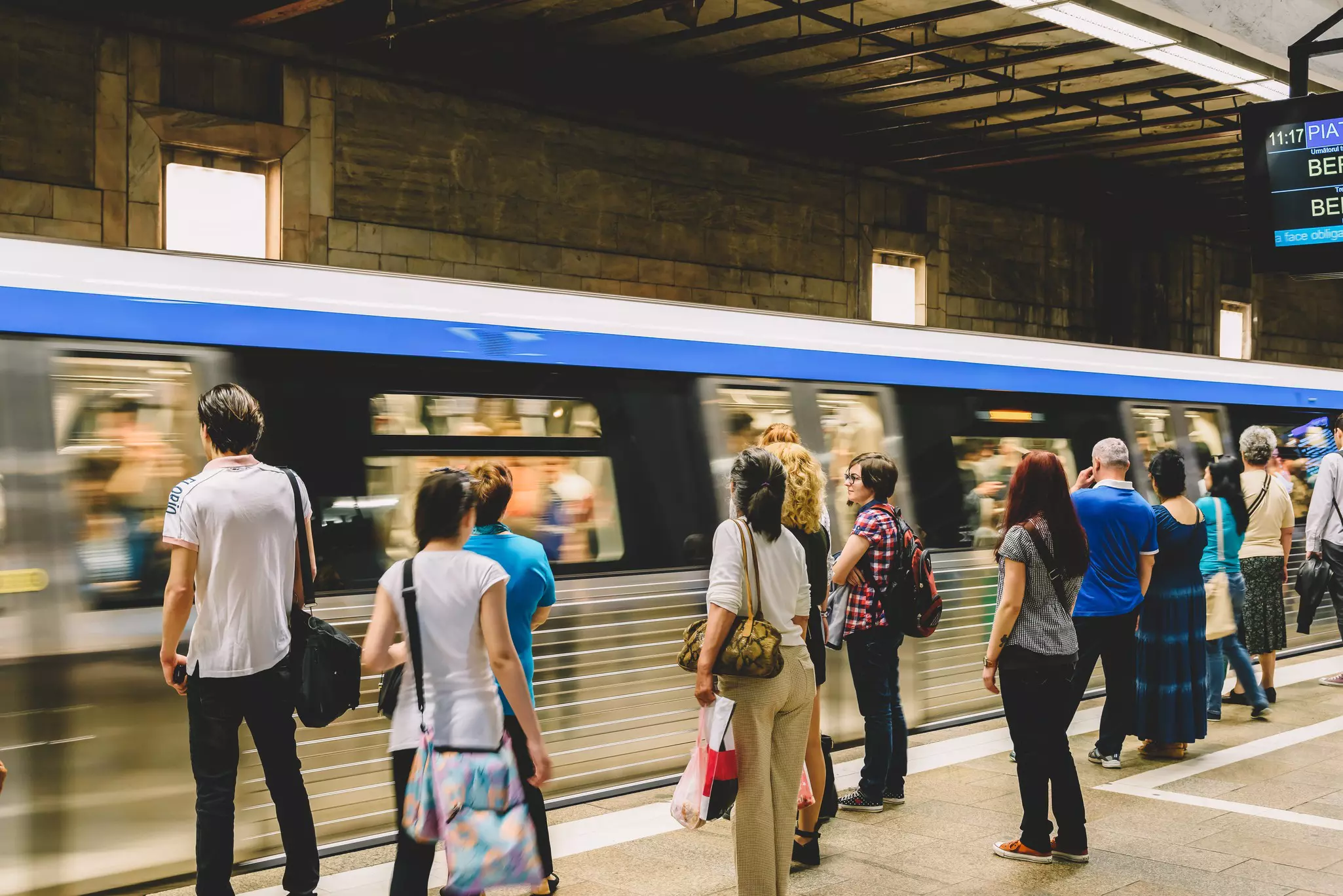 People getting on to a Subway Train in downtown Bucharest City, Romania