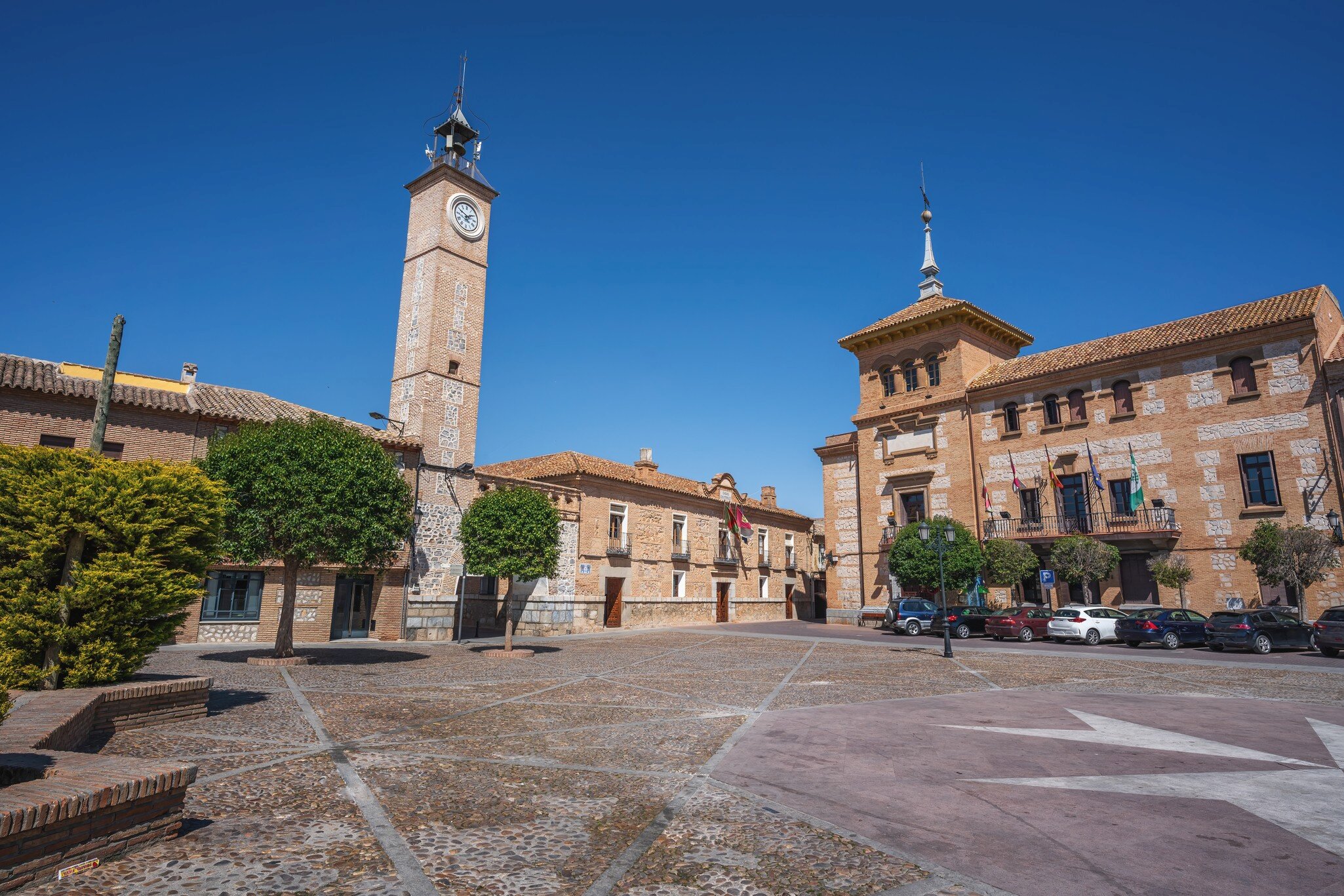 Plaza de Espana Square with Clock Tower (Torre del Reloj) and Consuegra City Hall - Consuegra, Castilla-La Mancha, Spain.