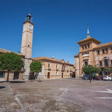 Plaza de Espana Square with Clock Tower (Torre del Reloj) and Consuegra City Hall - Consuegra, Castilla-La Mancha, Spain.
