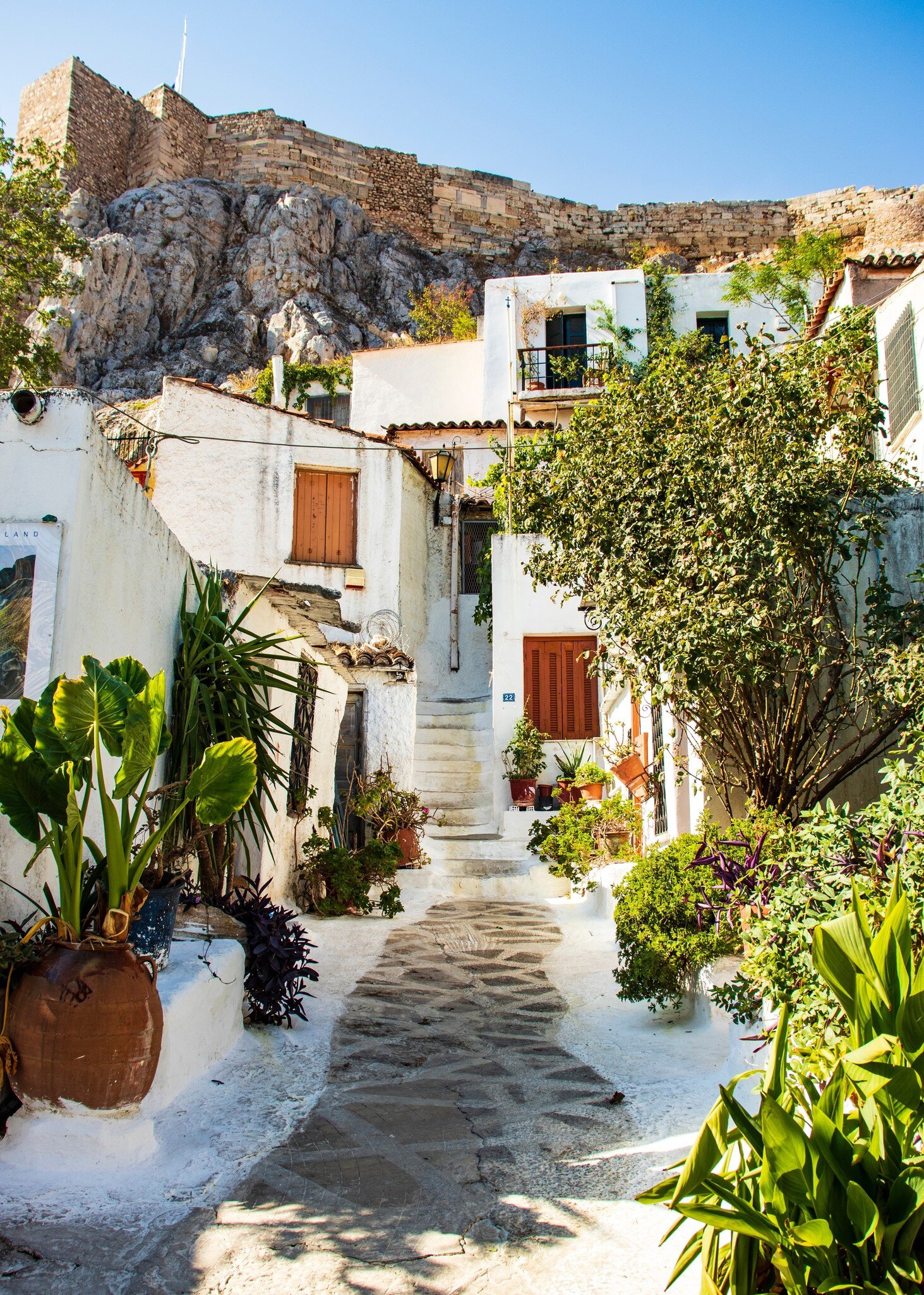 A winding path in the old district of Anafiotika in the center of Athens on a sunny day.