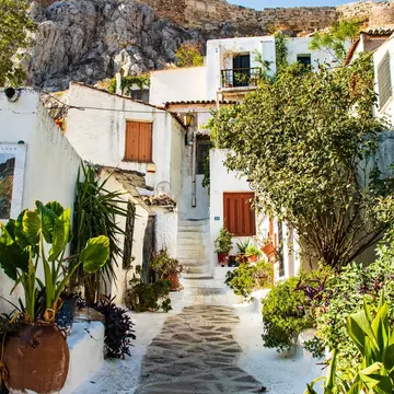 A winding path in the old district of Anafiotika in the center of Athens on a sunny day.