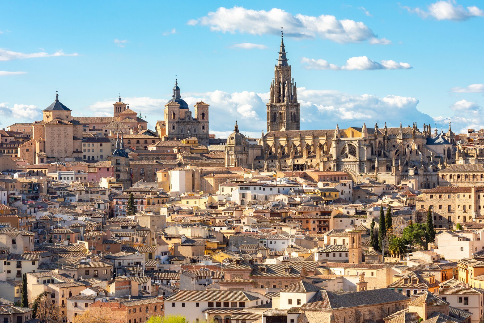 View of the Catedral de Toledo rising up above the old town in Toledo, Spain.