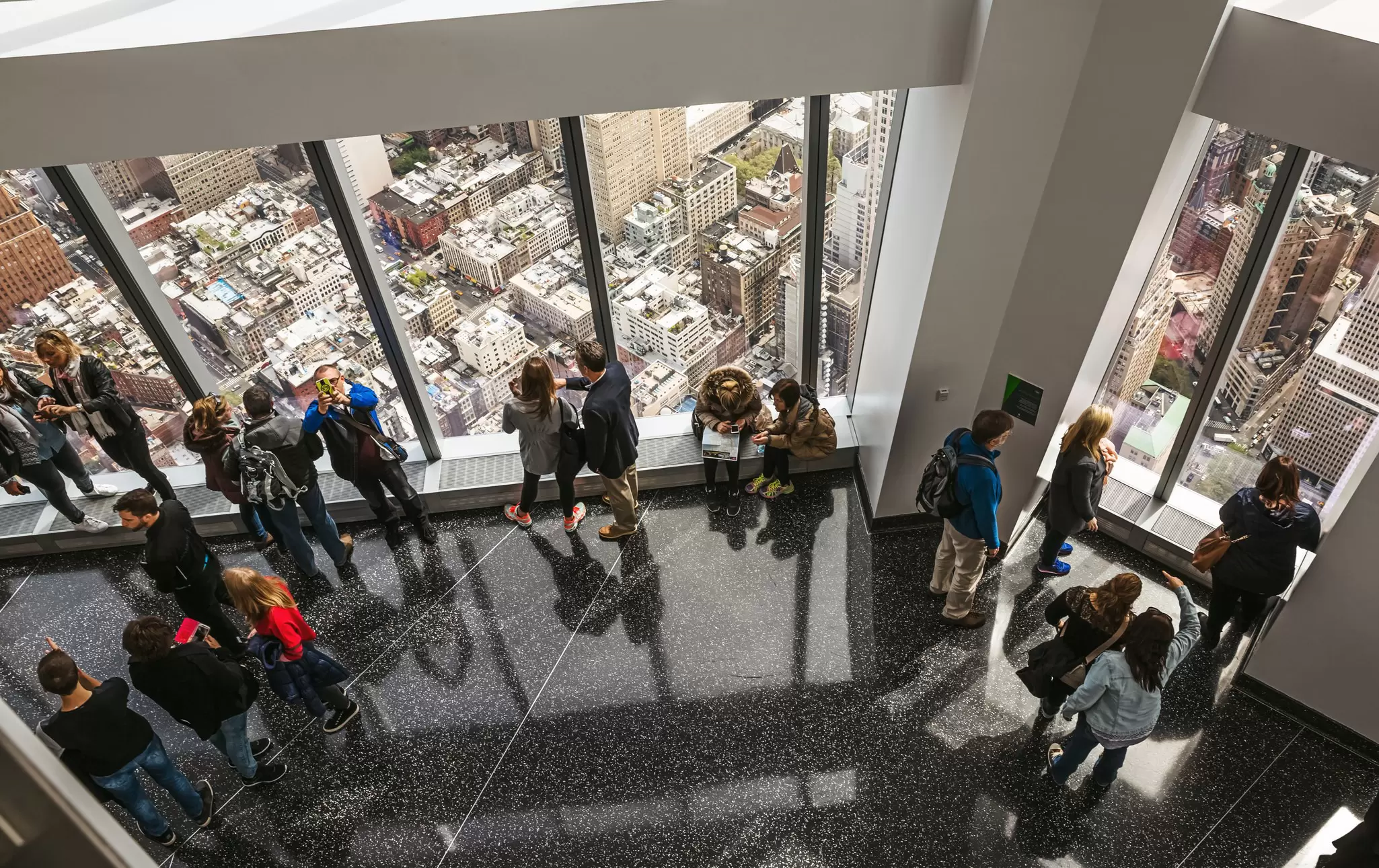 People looking at the view from One World Trade Center