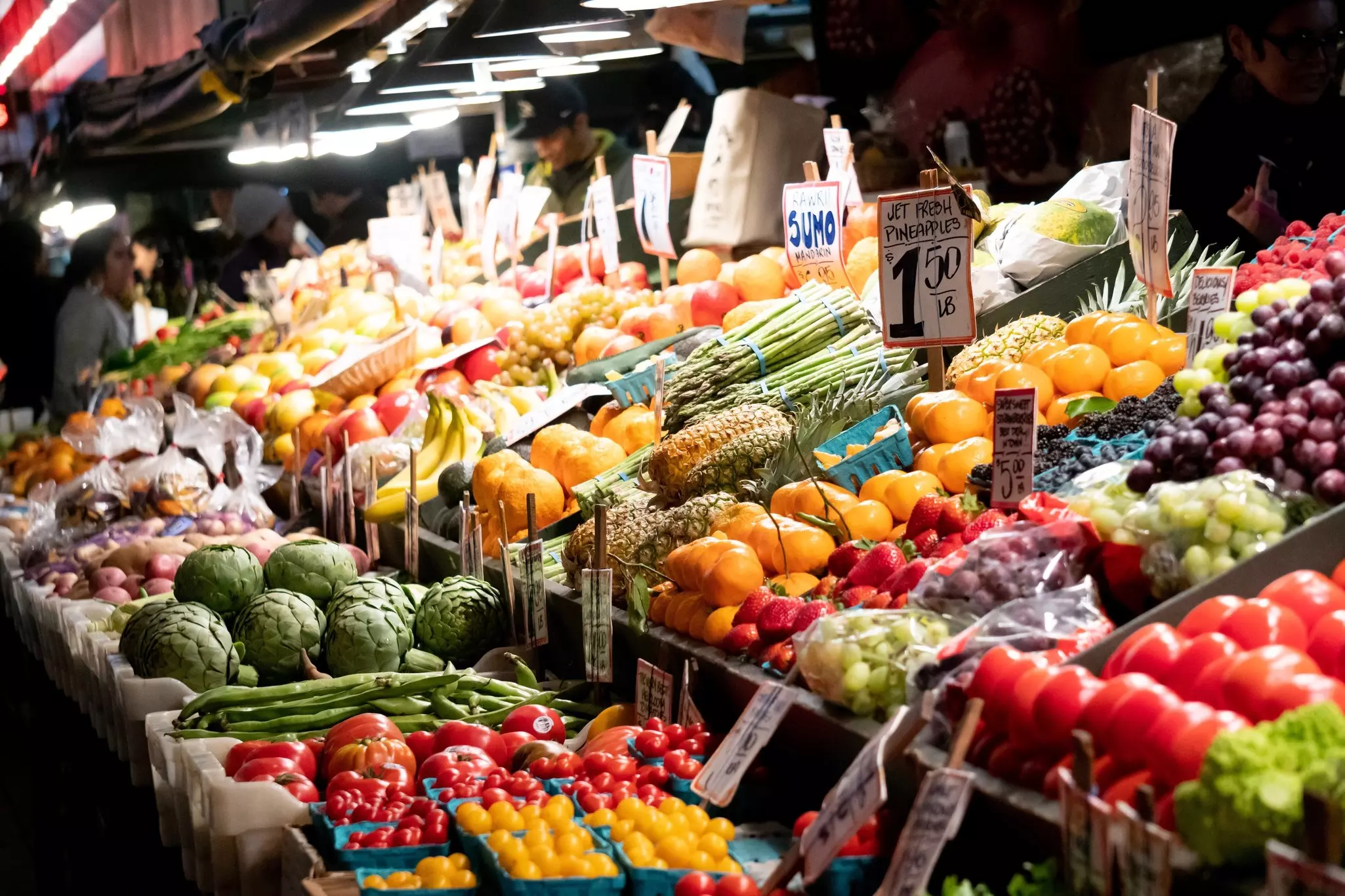 Colorful rows of fruits and vegetables in market displays