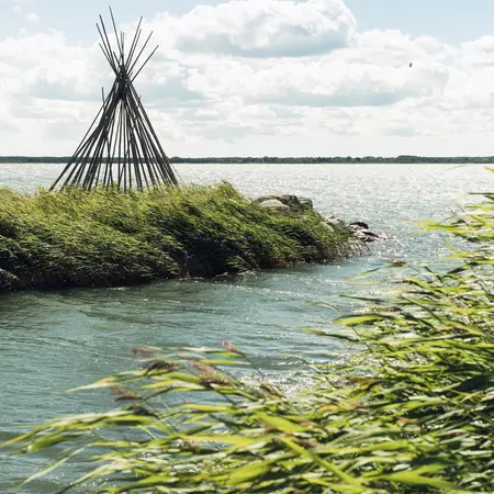 A wooden teepee on the wind-swept coast of Muhu.
