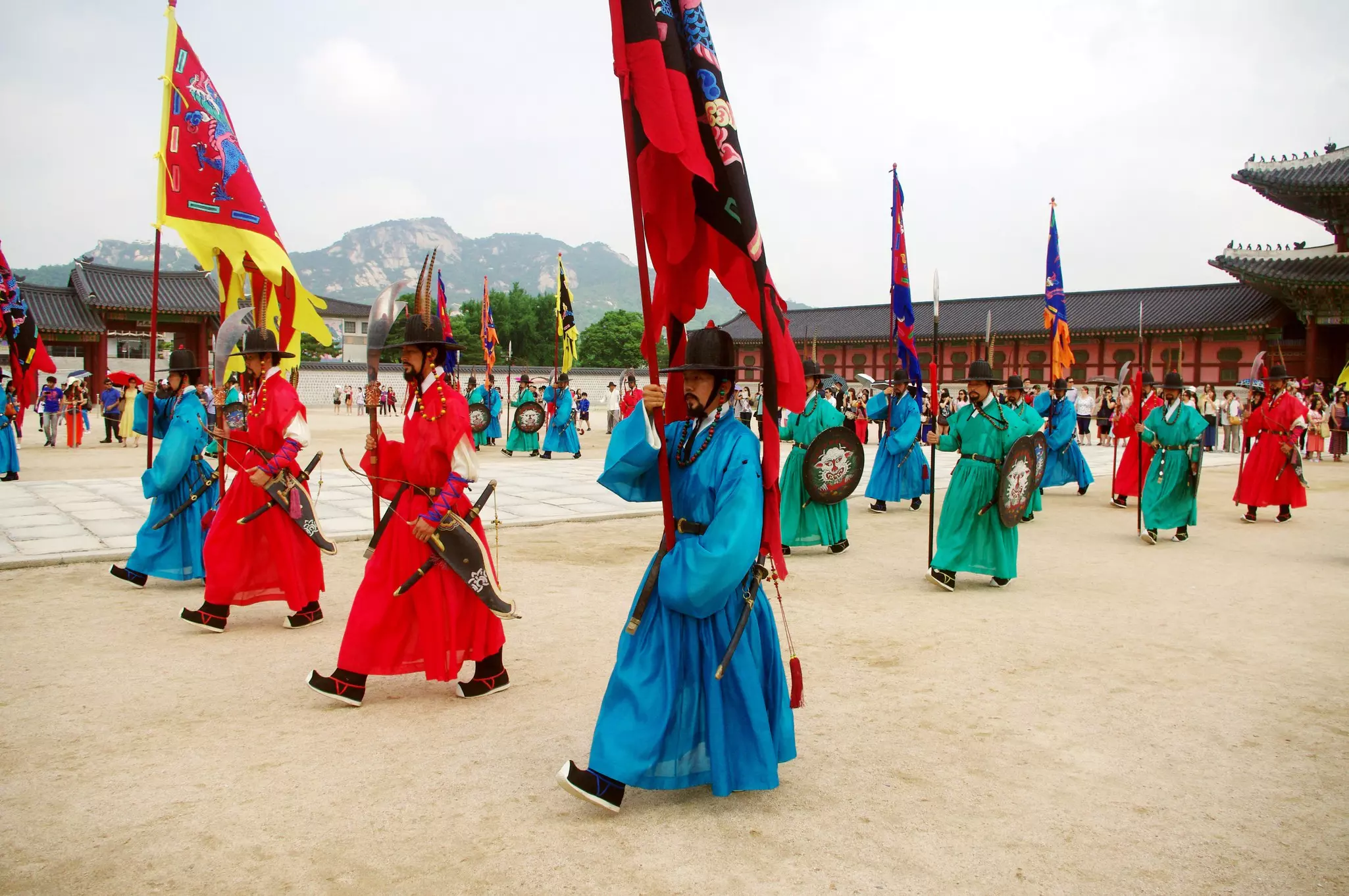 Soldiers in historic uniforms carrying pennants for the changing of the guard ceremony in Seoul, South Korea