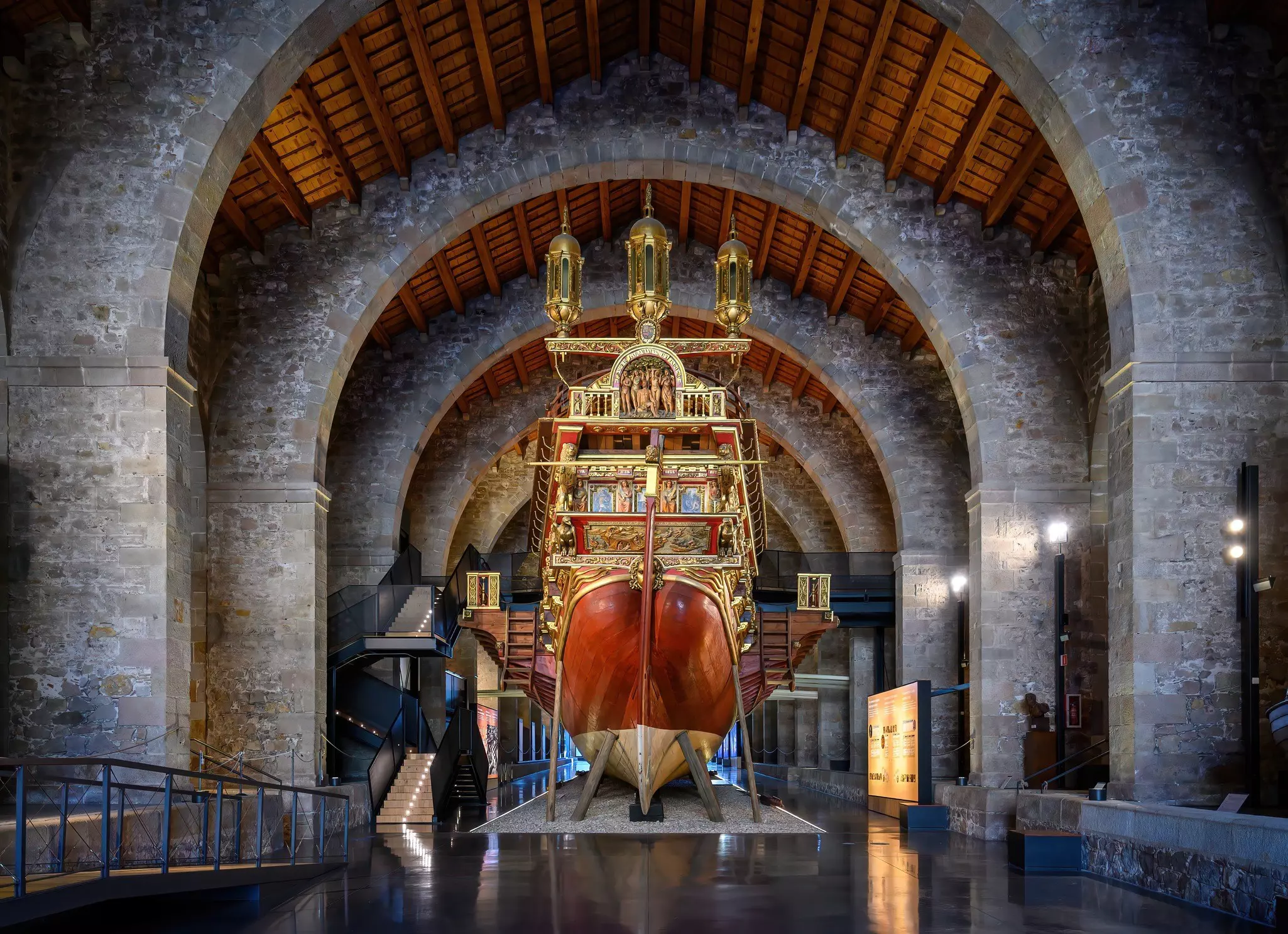 Full-scale replica of a ship inside a museum hall