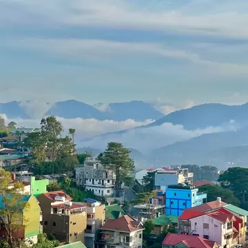 Colorful houses on a hillside in a mountain town.