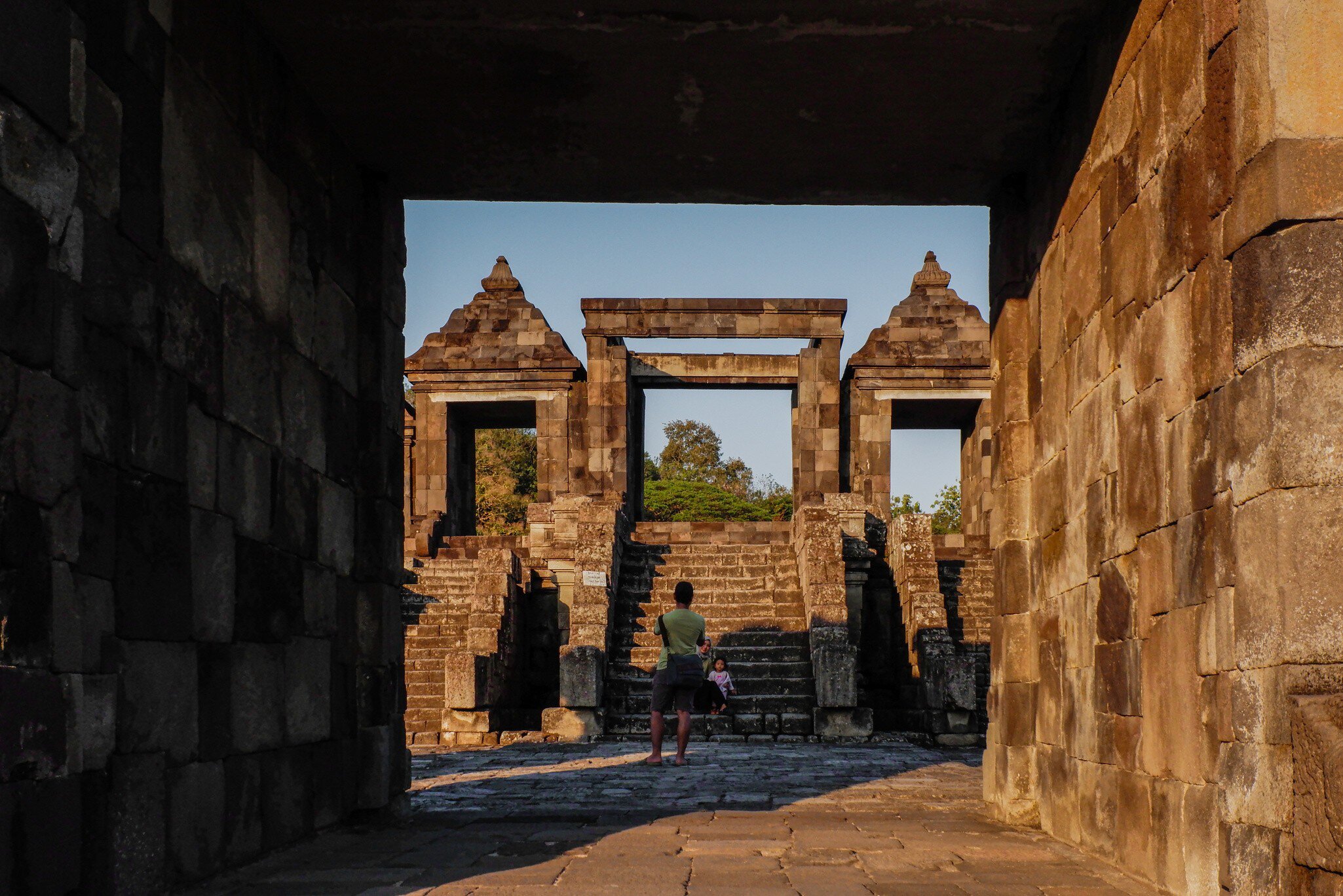 YOGYAKARTA, WEST JAVA, INDONESIA - 2025/07/21: Tourists visit Ratu Boko, an ancient hilltop archaeological site during sunset. Ratu Boko Temple is a relic of an ancient kingdom located on a hill. Known as a symbol of the glory of architecture and cultural arts from the past, Ratu Boko Temple has a rich and deep history that is reflected in every stone and relief. Ratu Boko is situated approximately 3 km south of the Prambanan Temple. The Ratu Boko area is situated on a hill with an elevation of 195.97 meters above sea level. The Ratu Boko site is actually not a temple, but the ruins of a kingdom. Therefore, Ratu Boko Temple is often also called Kraton Ratu Boko. It is called Kraton Boko, because according to legend, the site is the palace of Ratu Boko, Lara Jonggrang's father. It is estimated that the Ratu Boko site was built in the 8th century by the Buddhist Syailendra Dynasty, but was later taken over by the Hindu Mataram kings. The change of 'owner' caused the Kraton Boko building to be influenced by Hinduism and Buddhism. (Photo by Algi Febri Sugita/SOPA Images/LightRocket via Getty Images)
2225803425
historic, temple, hilltop, tourists, archaeological site, sacred place, palace of ratu boko, historical, setting sun, ratu boko temple, ratu boko, ancient kingdom, historical site
Tourists visit Ratu Boko, an ancient hilltop archaeological