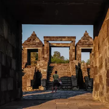 YOGYAKARTA, WEST JAVA, INDONESIA - 2025/07/21: Tourists visit Ratu Boko, an ancient hilltop archaeological site during sunset. Ratu Boko Temple is a relic of an ancient kingdom located on a hill. Known as a symbol of the glory of architecture and cultural arts from the past, Ratu Boko Temple has a rich and deep history that is reflected in every stone and relief. Ratu Boko is situated approximately 3 km south of the Prambanan Temple. The Ratu Boko area is situated on a hill with an elevation of 195.97 meters above sea level. The Ratu Boko site is actually not a temple, but the ruins of a kingdom. Therefore, Ratu Boko Temple is often also called Kraton Ratu Boko. It is called Kraton Boko, because according to legend, the site is the palace of Ratu Boko, Lara Jonggrang's father. It is estimated that the Ratu Boko site was built in the 8th century by the Buddhist Syailendra Dynasty, but was later taken over by the Hindu Mataram kings. The change of 'owner' caused the Kraton Boko building to be influenced by Hinduism and Buddhism. (Photo by Algi Febri Sugita/SOPA Images/LightRocket via Getty Images)
2225803425
historic, temple, hilltop, tourists, archaeological site, sacred place, palace of ratu boko, historical, setting sun, ratu boko temple, ratu boko, ancient kingdom, historical site
Tourists visit Ratu Boko, an ancient hilltop archaeological