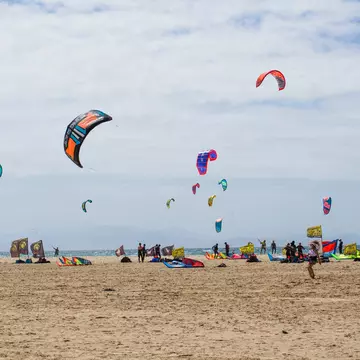View of kitesurfers at Playa de Valdevaqueros in Tarifa, Spain.
