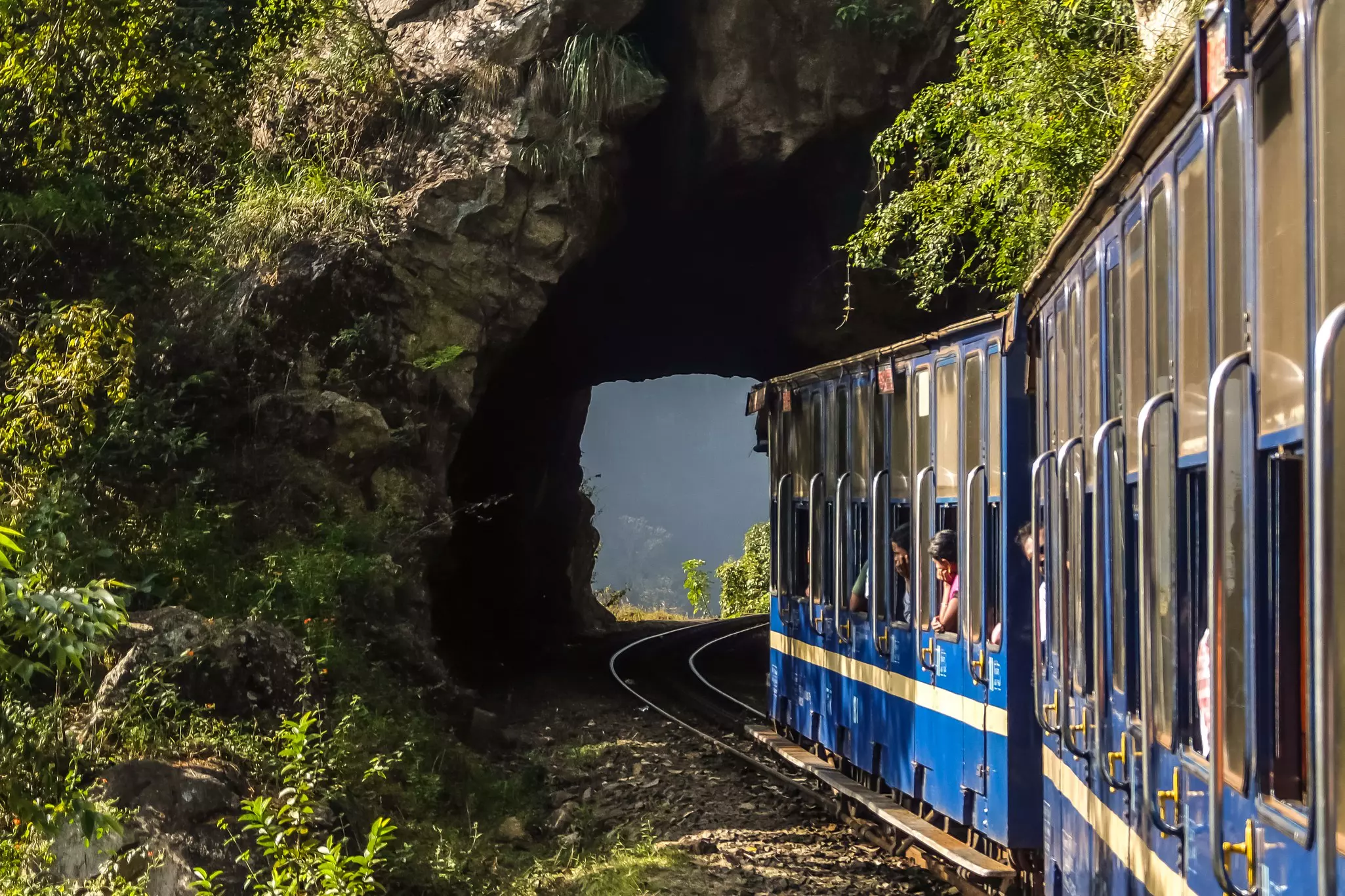 A train passes through a tunnel on the Nilgiri Mountain Railway, Udagamandalam, India.